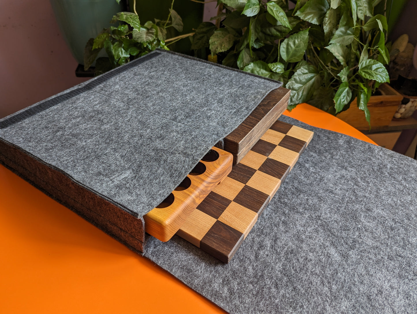 Handcrafted wooden carved chess pieces. White maple and walnut wood.