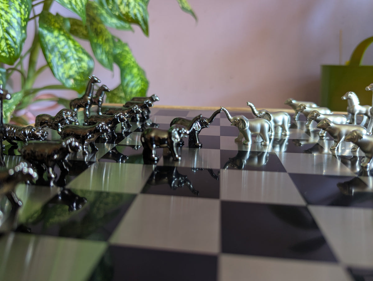 Luxury unusual chess set. Metal animal chess pieces in walnut box