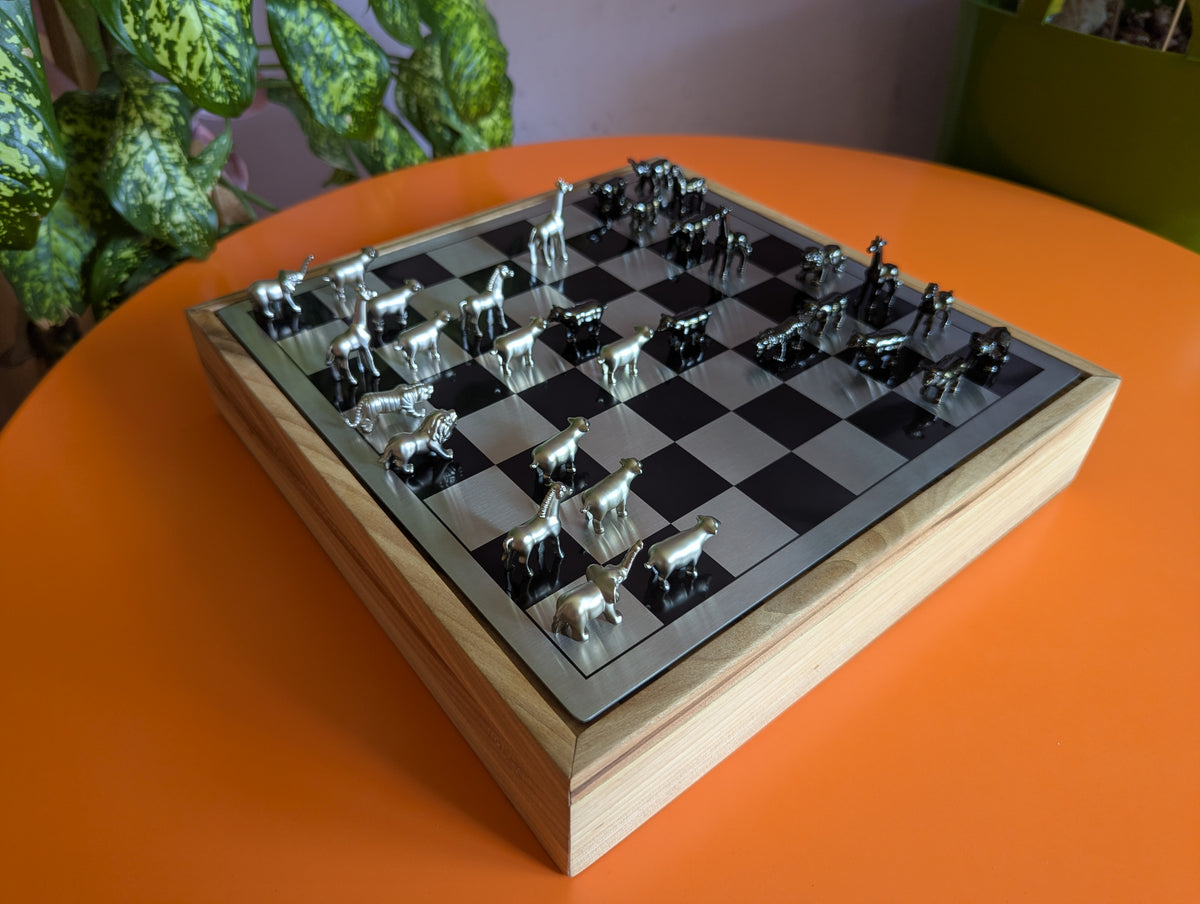 Luxury unusual chess set. Metal animal chess pieces in walnut box