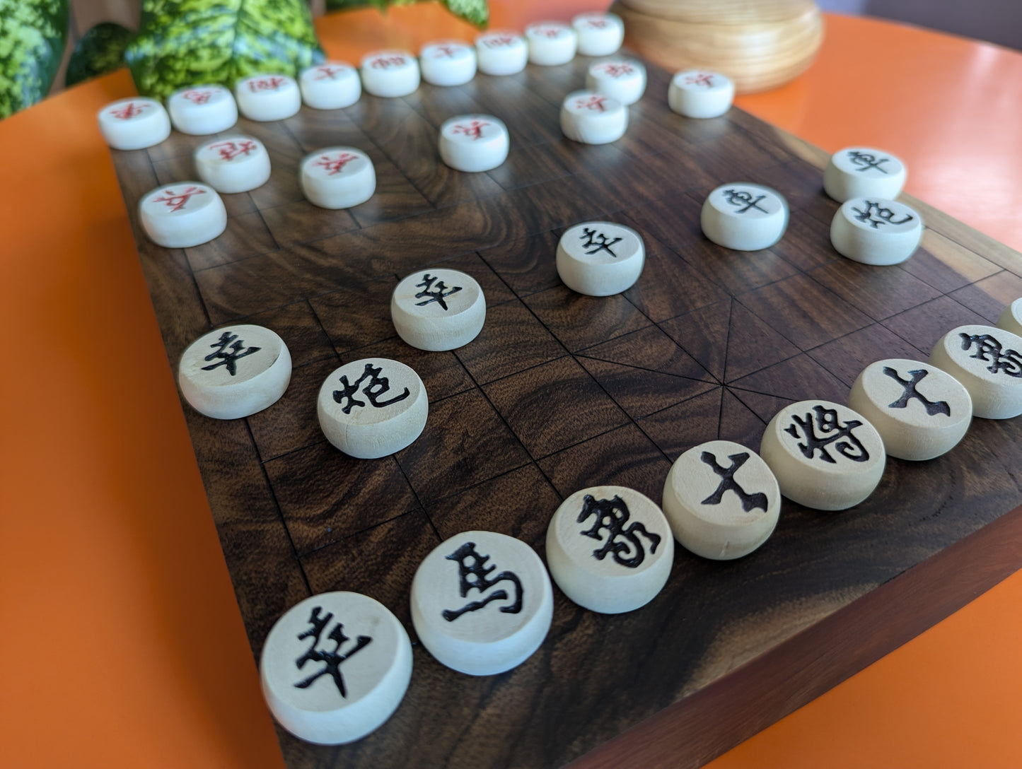 Solid walnut Xiangqi game set. Hand carved lines