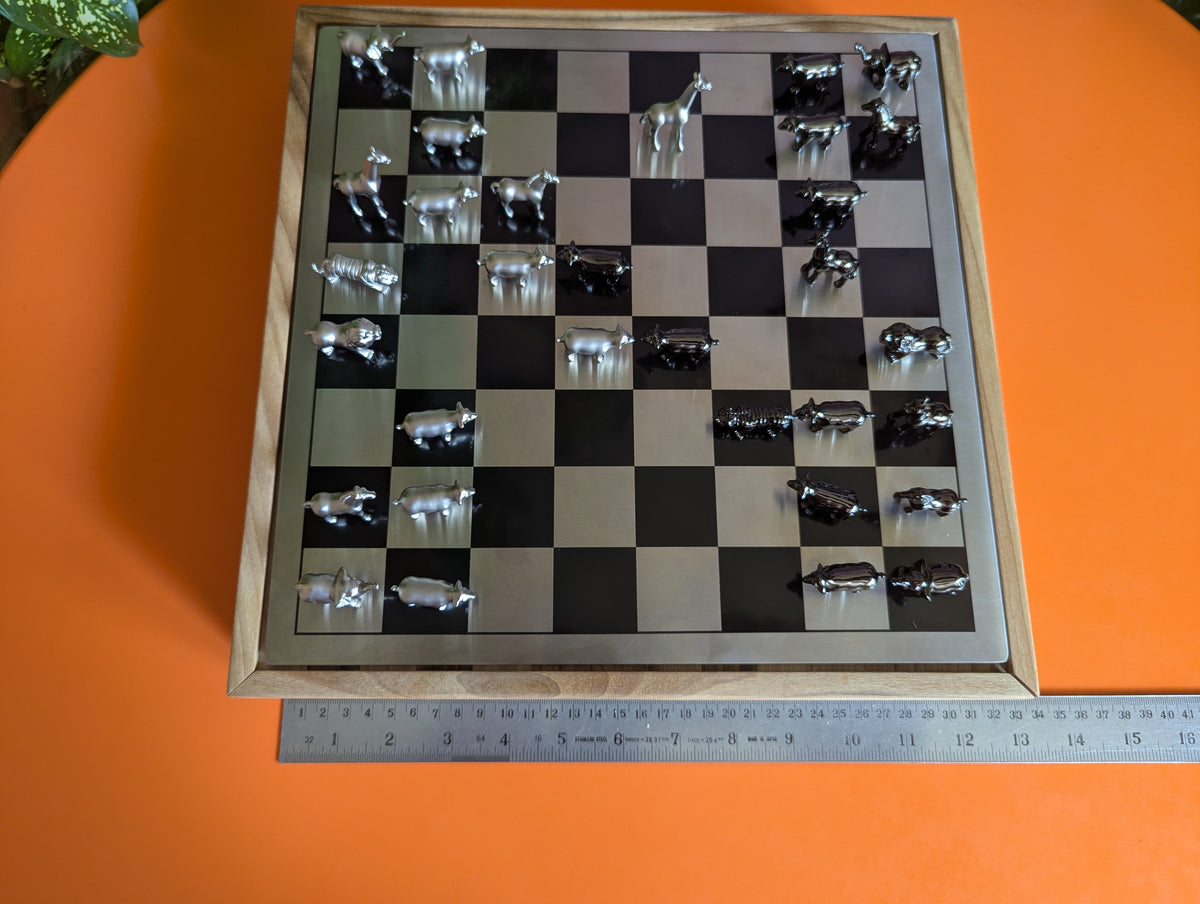 Luxury unusual chess set. Metal animal chess pieces in walnut box
