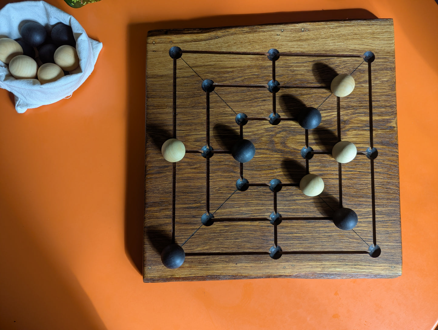 Handmade Twelve/Nine men's Morris game set. Solid oak wood board with live egde.