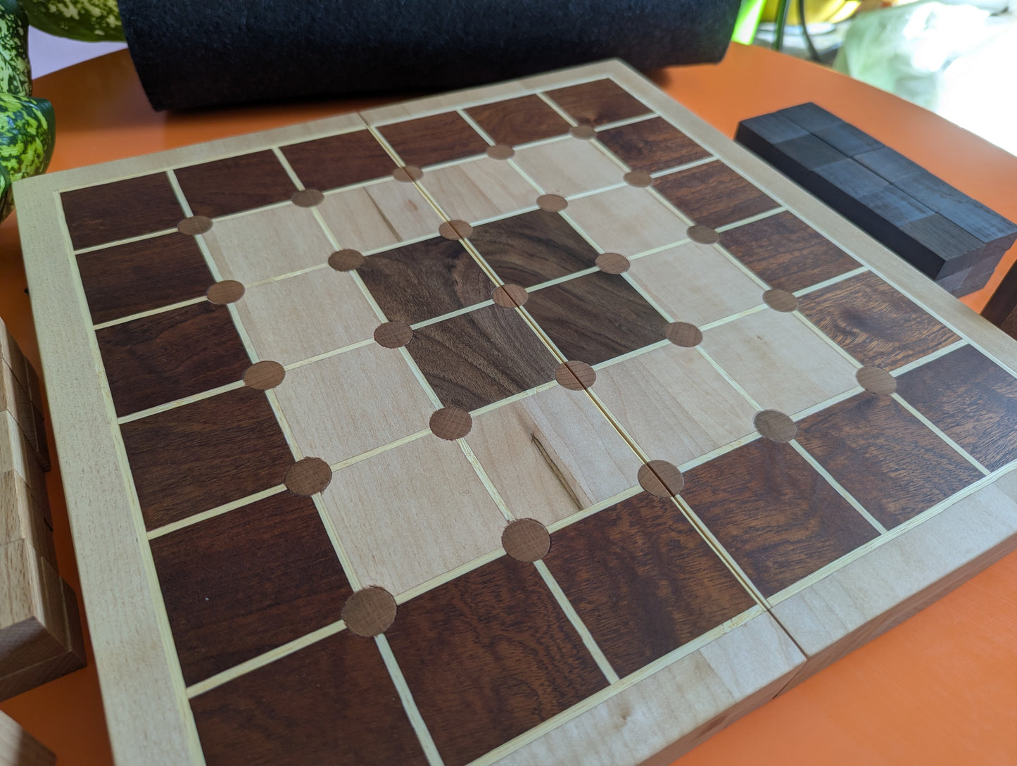 Foldable wooden Tak game set.