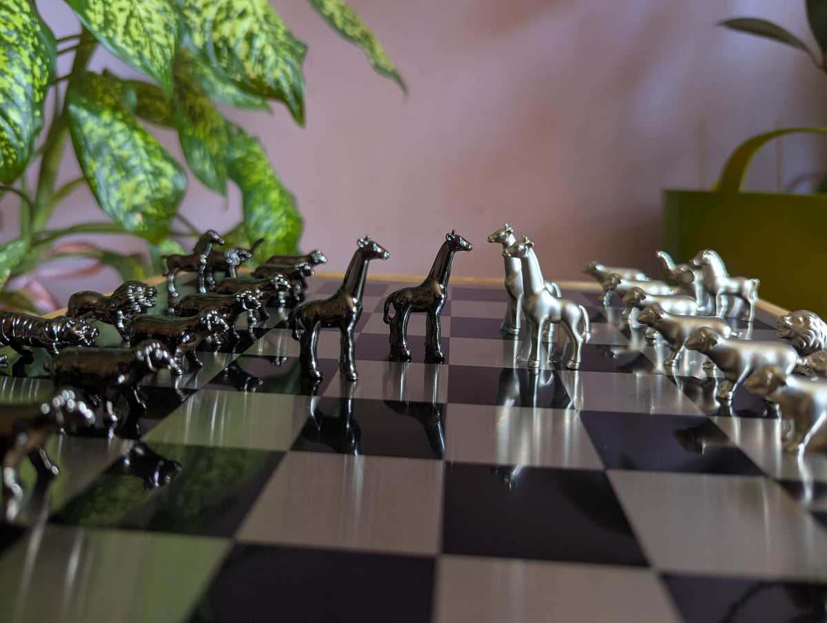 Luxury unusual chess set. Metal animal chess pieces in walnut box