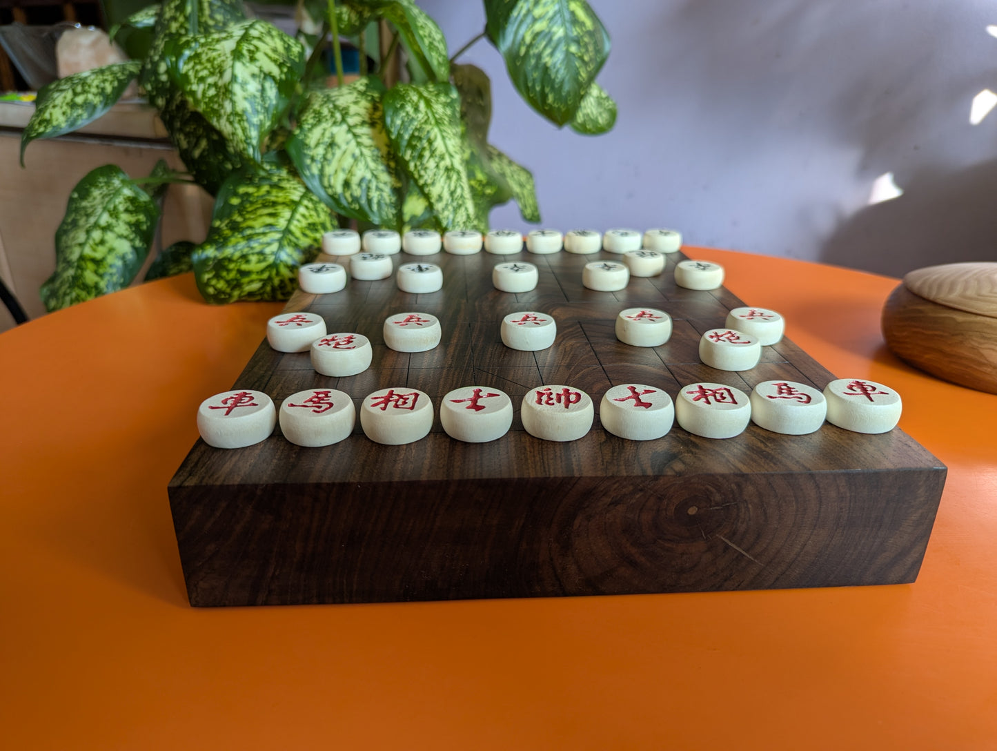 Solid walnut Xiangqi game set. Hand carved lines