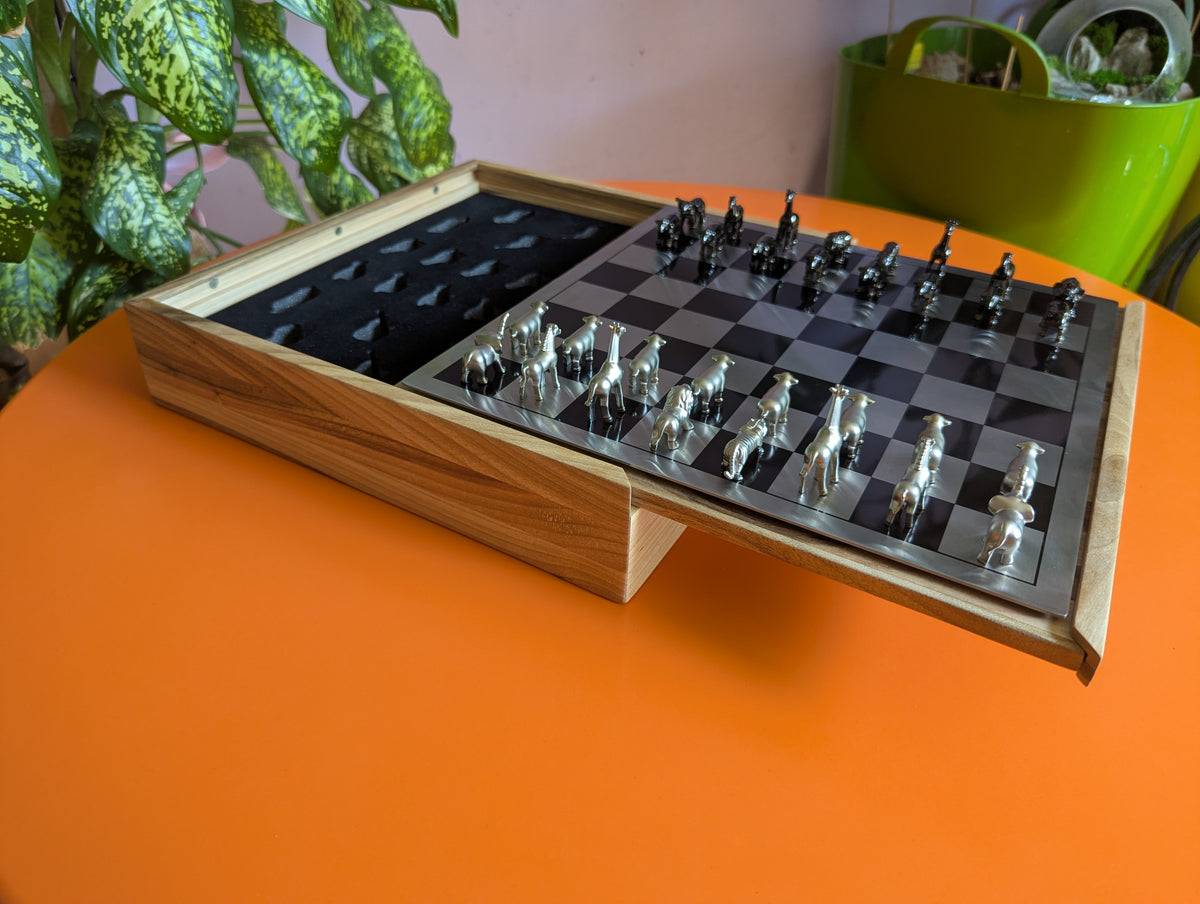 Luxury unusual chess set. Metal animal chess pieces in walnut box