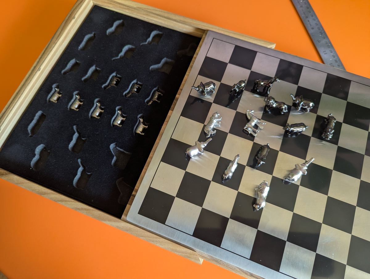 Luxury unusual chess set. Metal animal chess pieces in walnut box