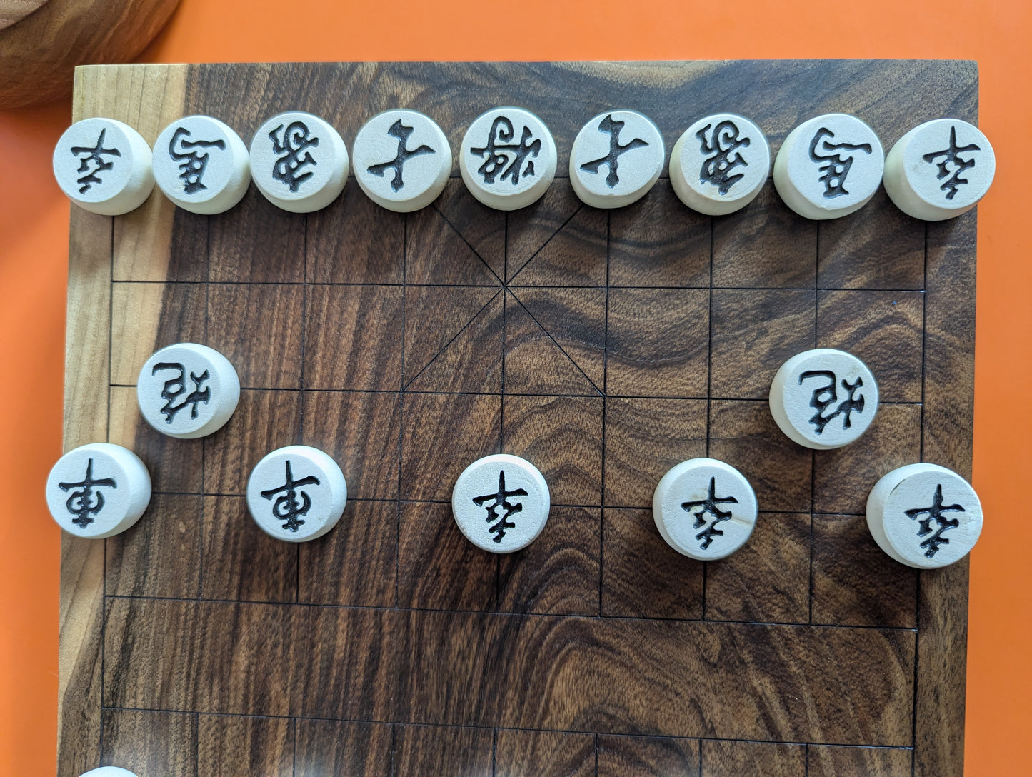 Solid walnut Xiangqi game set. Hand carved lines