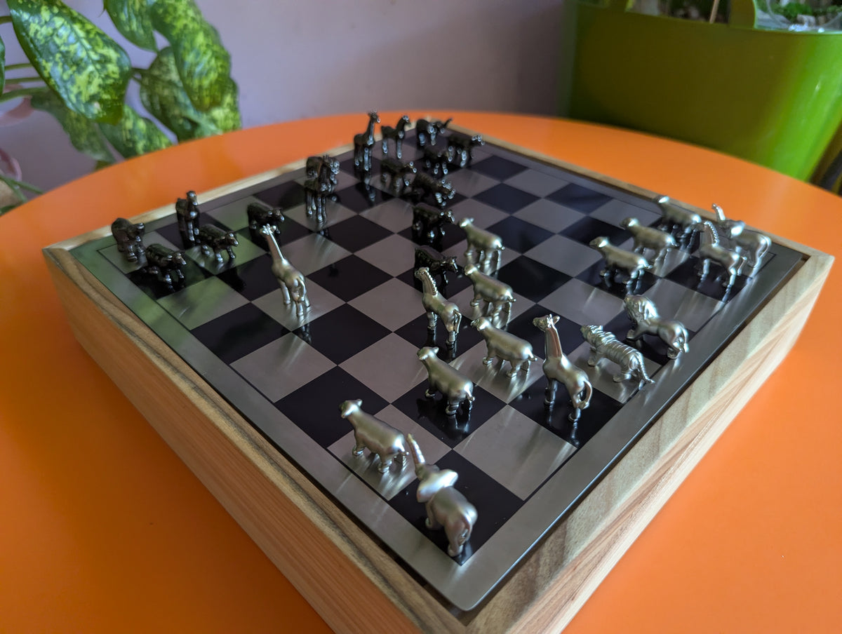 Luxury unusual chess set. Metal animal chess pieces in walnut box