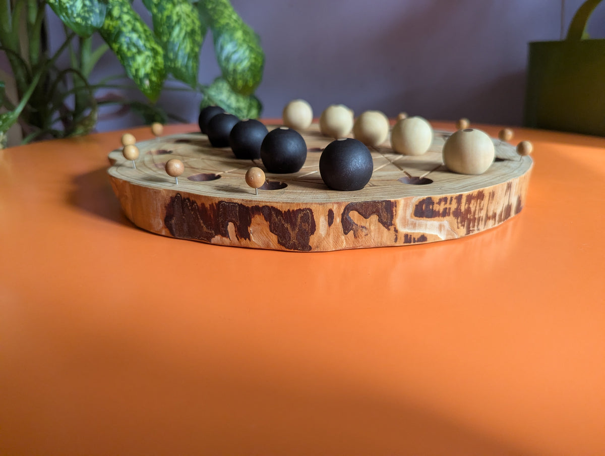 JarmoArena game set. Circle juniper wood board with live edge.