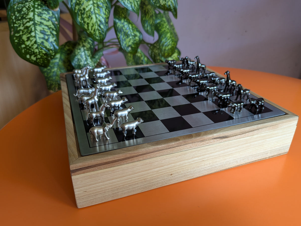 Luxury unusual chess set. Metal animal chess pieces in walnut box