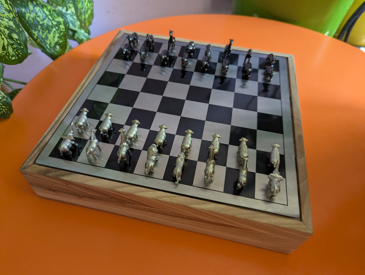 Luxury unusual chess set. Metal animal chess pieces in walnut box
