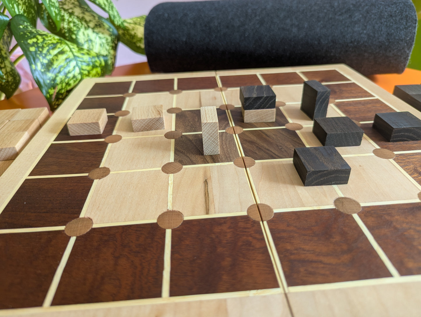 Foldable wooden Tak game set.