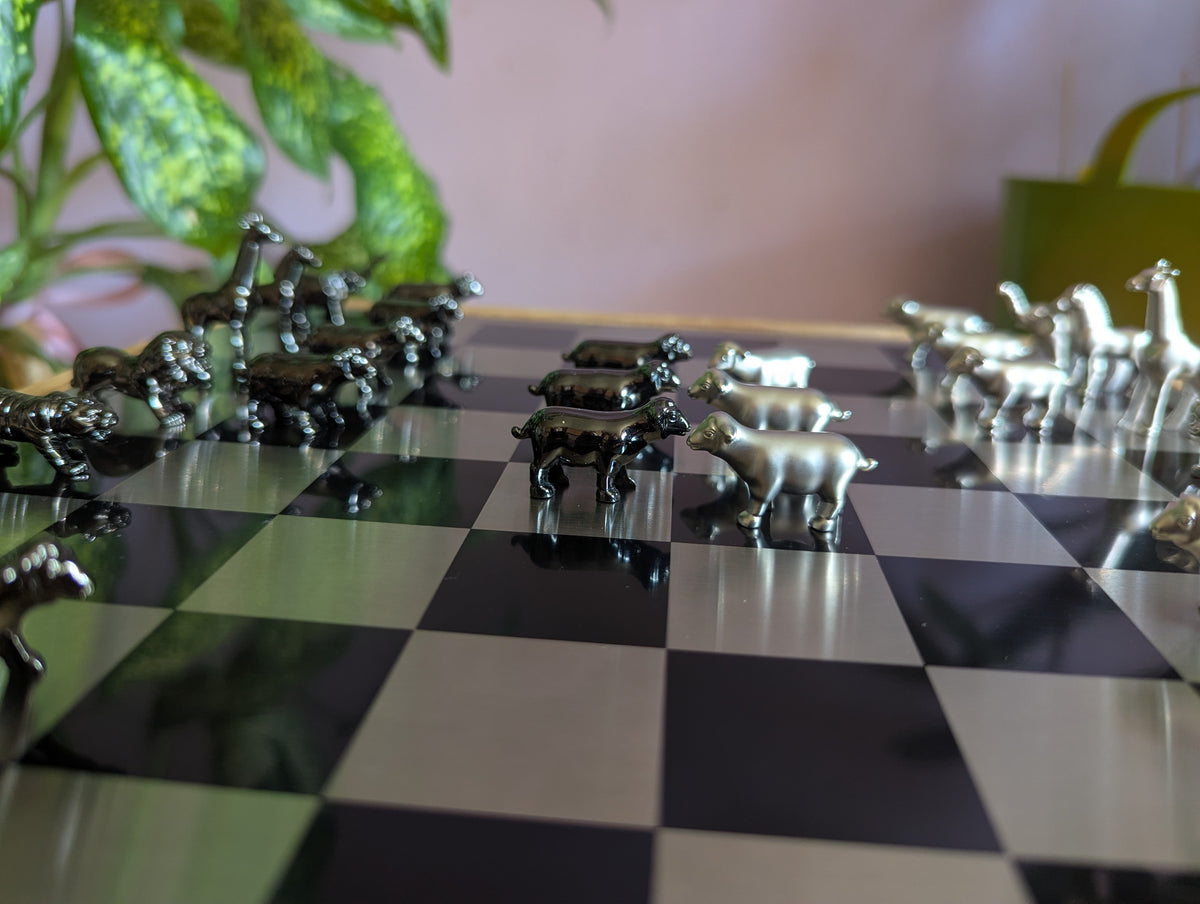 Luxury unusual chess set. Metal animal chess pieces in walnut box