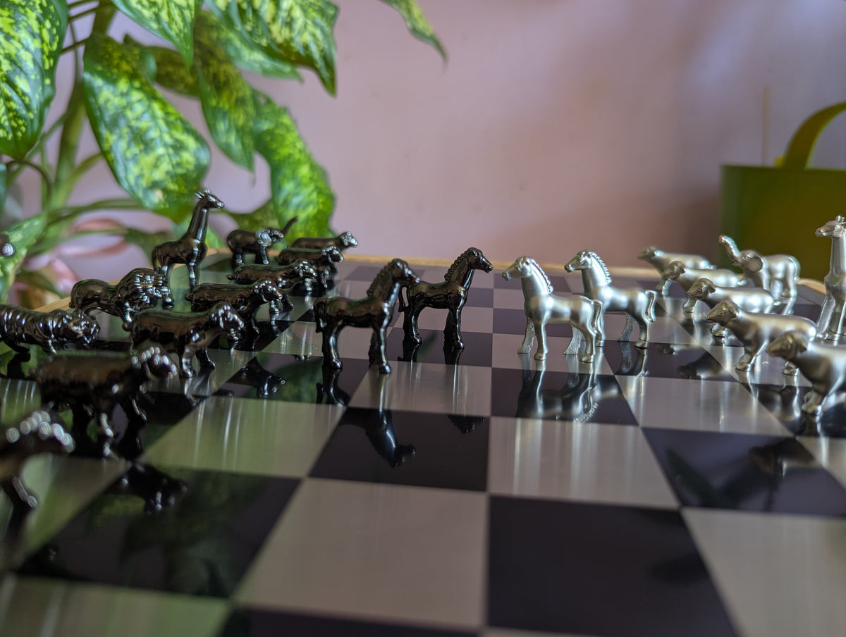 Luxury unusual chess set. Metal animal chess pieces in walnut box