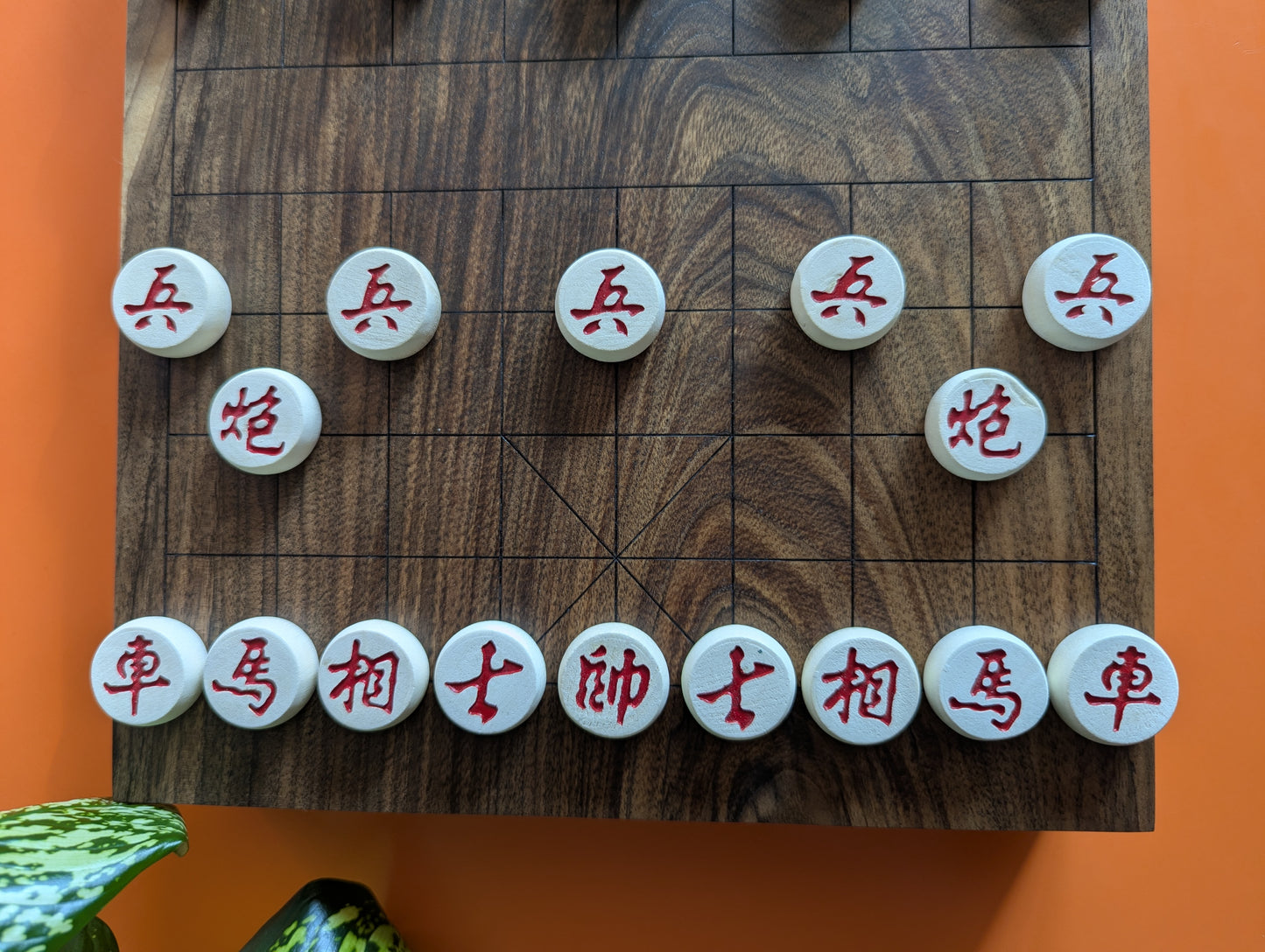 Solid walnut Xiangqi game set. Hand carved lines