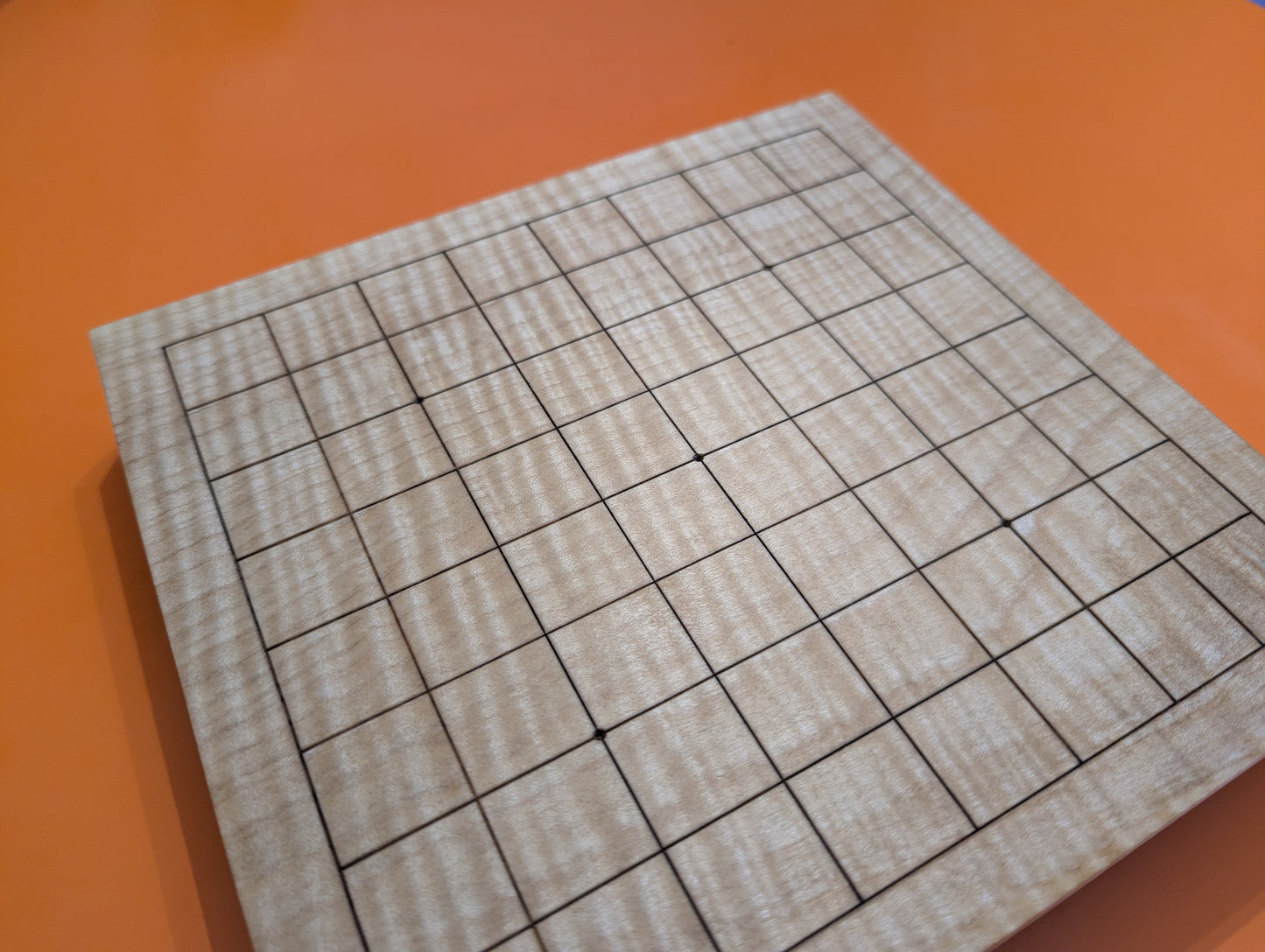 Solid maple 9x9 Goban with wave grain wood. Hand carved game Go board.