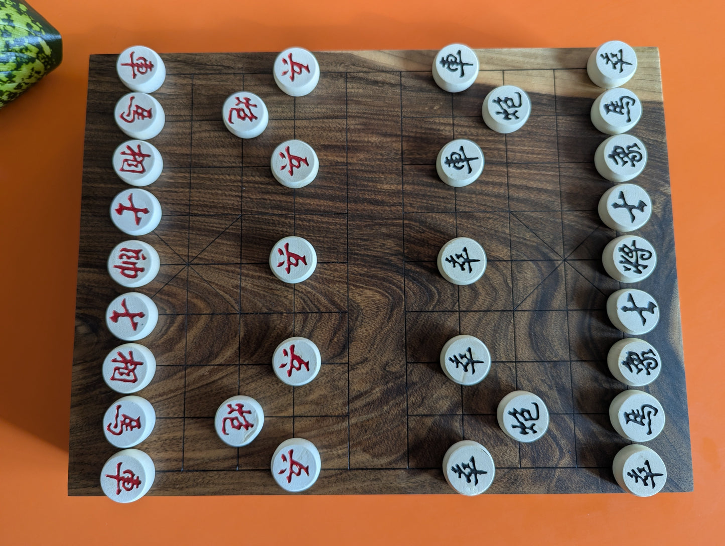 Solid walnut Xiangqi game set. Hand carved lines