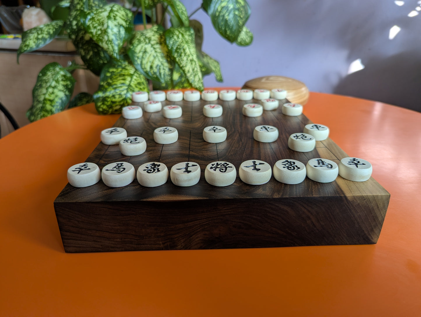 Solid walnut Xiangqi game set. Hand carved lines